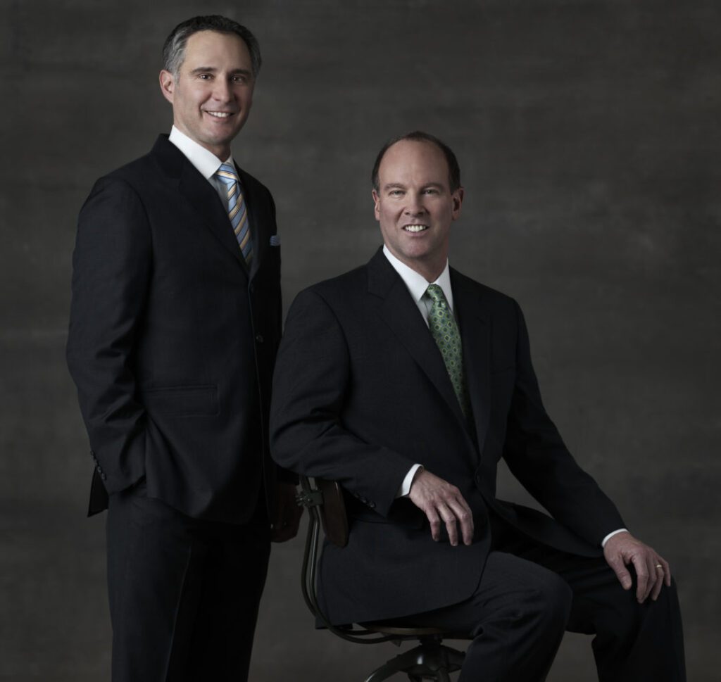 Annapolis Plastic Surgeons Dr. Ambro and Dr. Chappell in black suits