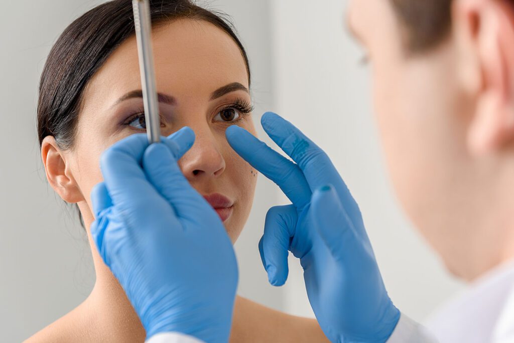 doctor touching brown hair female patient face