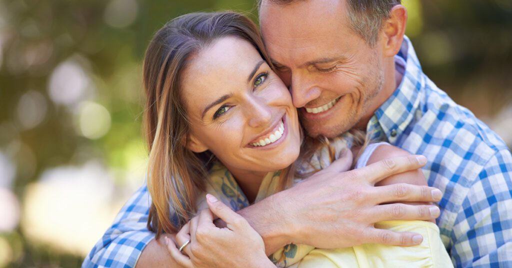 male and female hugging in spring season