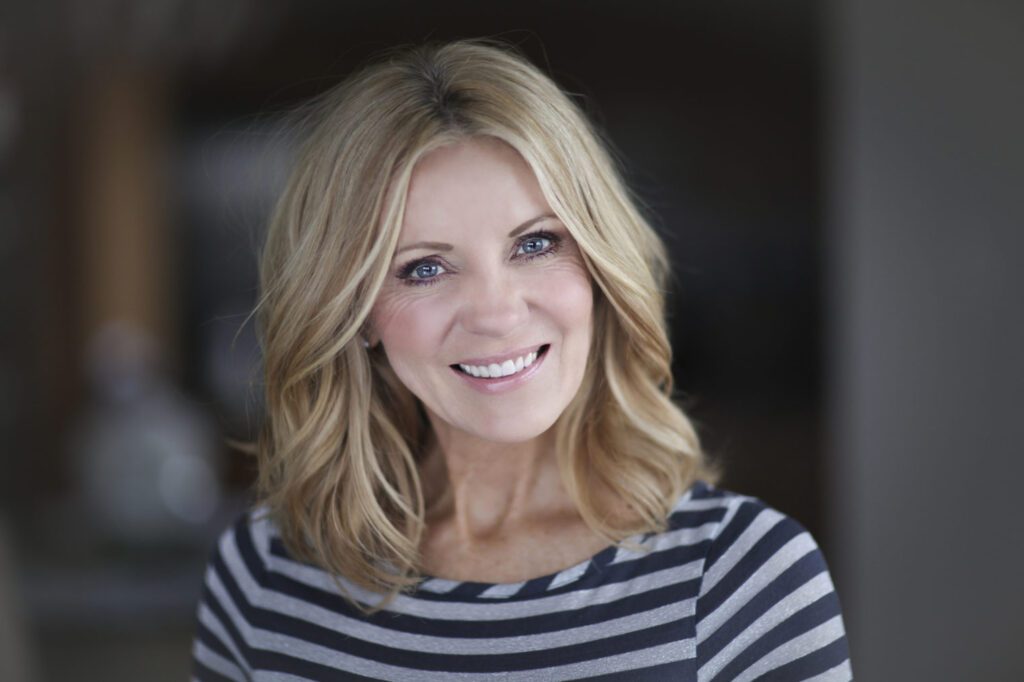 blonde hair female with striped shirt