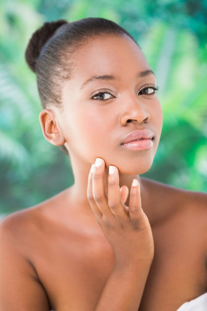 African american female touching face